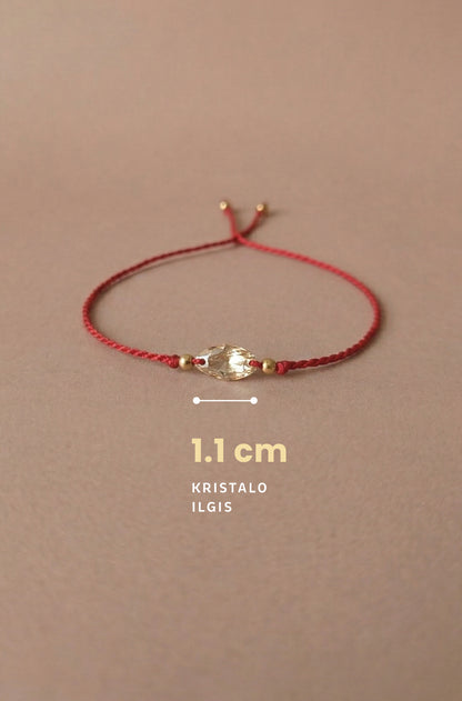 Red bracelet with gold