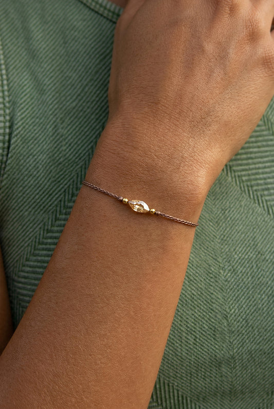 Rudo siulo apyrankes su kristalu ir auksu.